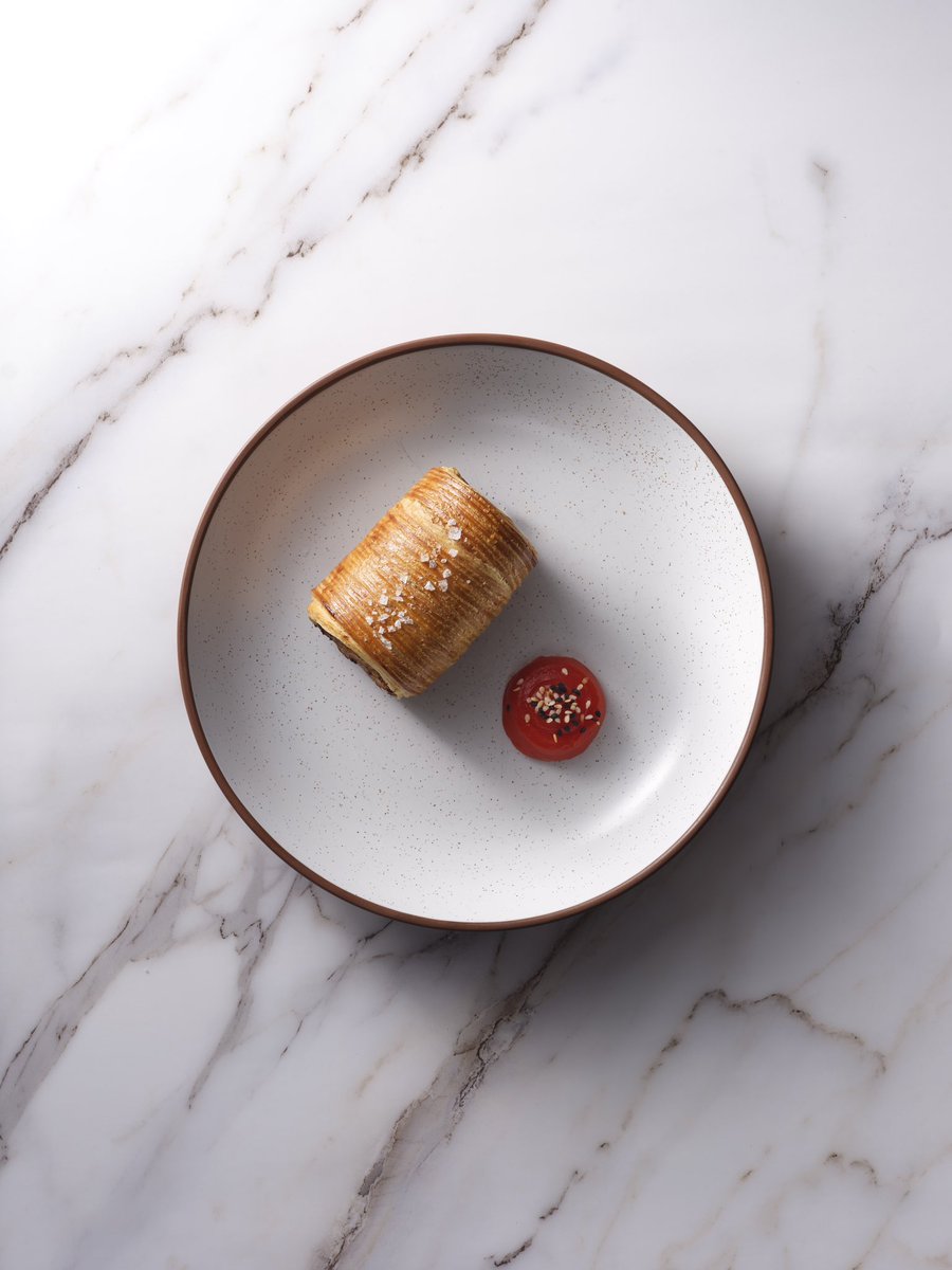 Cross laminated dogfish sausage roll 🐟 The current roll includes dogfish sausage meat with black garlic (thanks @__Feast__ !), and house fermented chilli sriracha. What we particularly love is the collaboration on this dish with @VittleBakeshop aka the pastry kings and queens