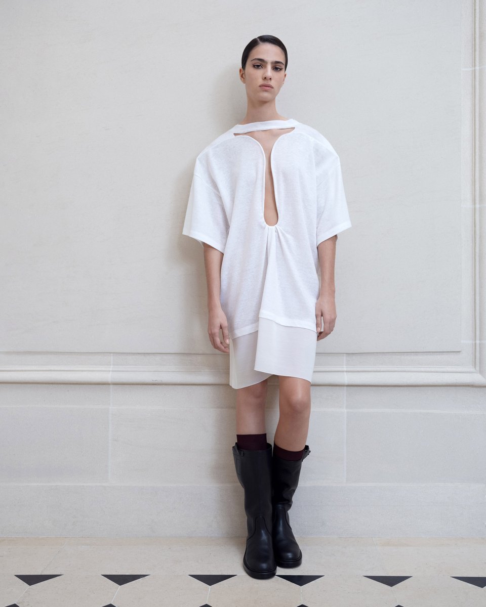 Jersey t-shirt dresses are elevated with cut-out details and sheer panelling. Discover #VBSS24 >> victoriabeckham.visitlink.me/XrMjox