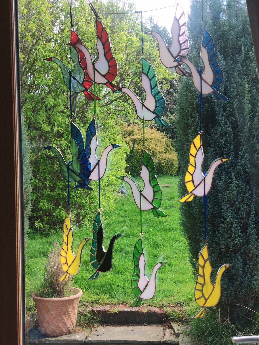 A bakers dozen stained glass cranes from #dolittleglass. Inspired by the Japanese 1000 cranes story.  #1000cranes 
I'm making these for display and sale during Warwickshire Open Studios #Wos2024 
Proceeds will be donated to charity.