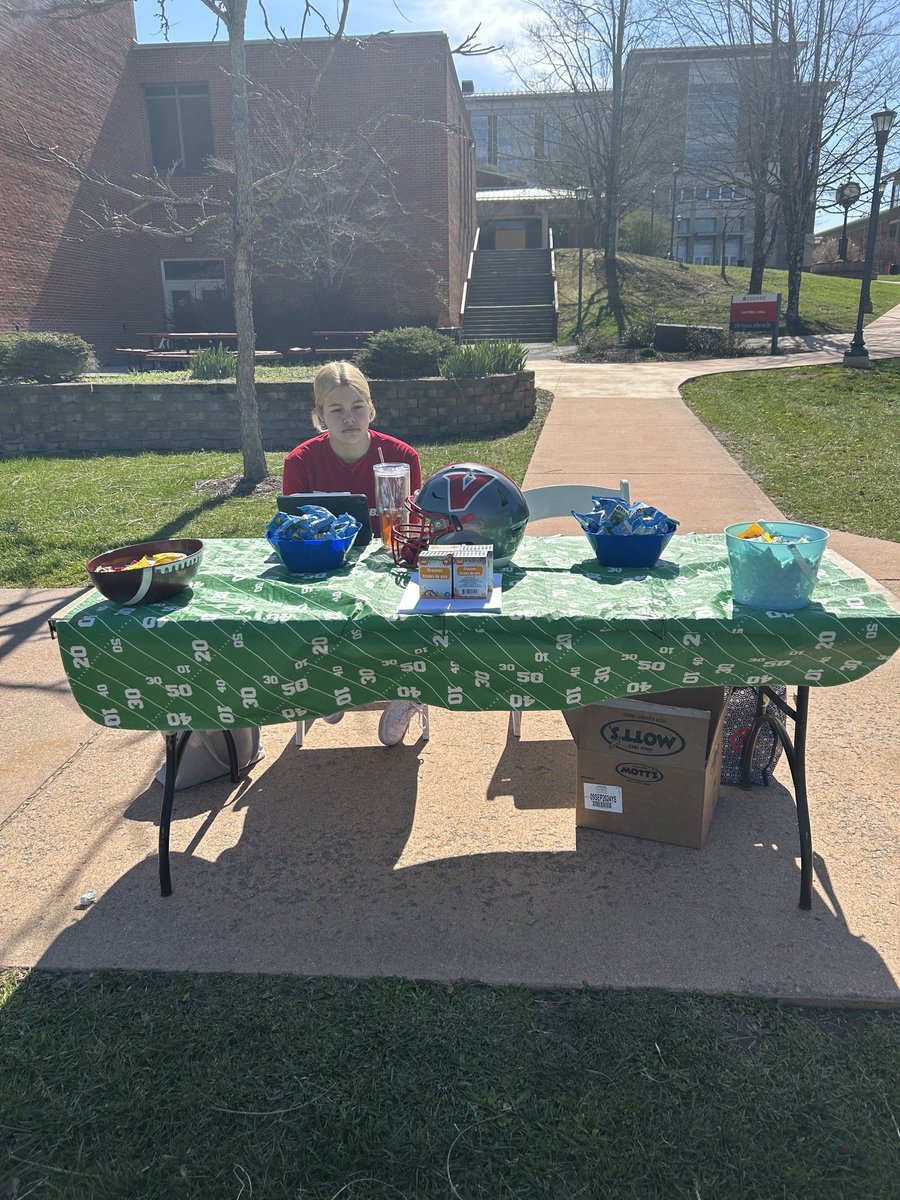 ⁦@UVAWiseCavsFB⁩ has a table full of candy and coloring for the Easter Egg hunt today on the campus! #PEWAV #FFF #HTR