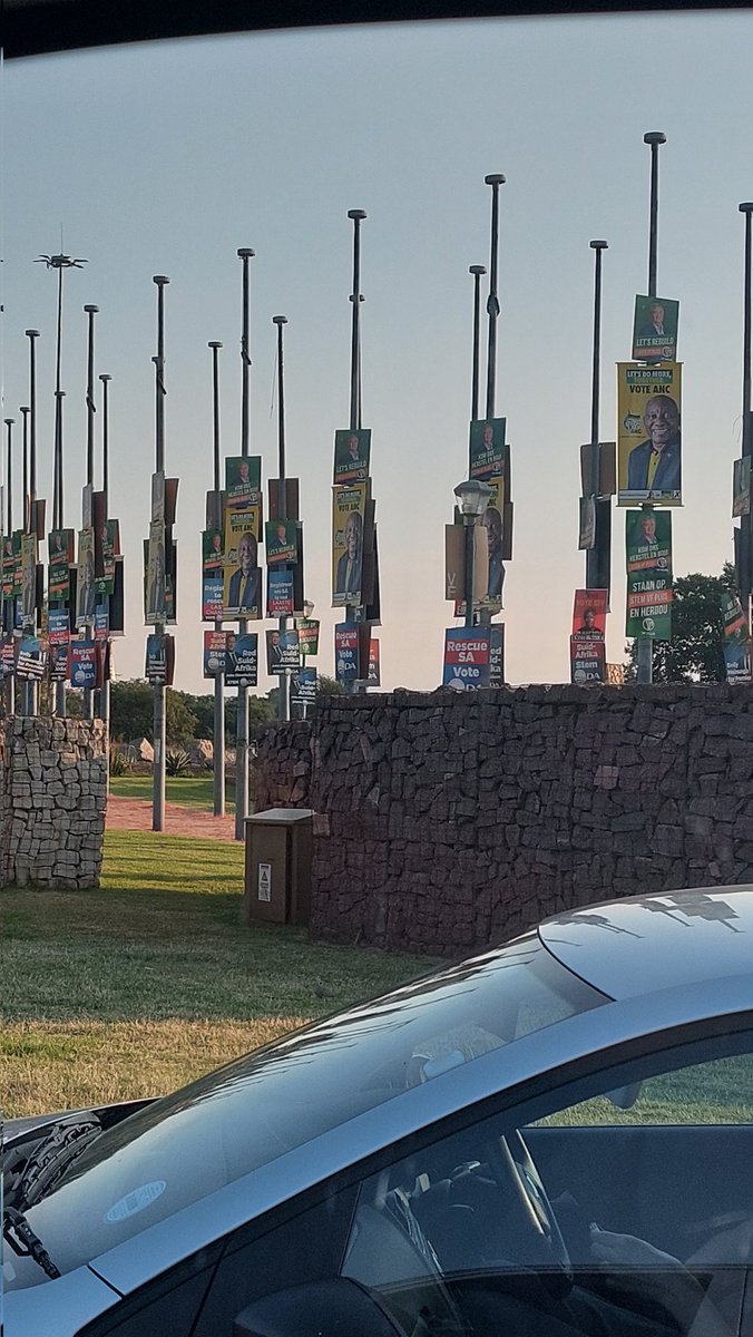 NickyRussell3's tweet photo. @CityofTshwane @CilliersB And here is proof: @CityofTshwane @IECSouthAfrica @CilliersB double height @MYANC posters at Fountains Circle, Pretoria.

Also, these are flag poles, not street light poles.

@Our_DA @VFPlus @EFFSouthAfrica https://t.co/kgg6R4f3P9