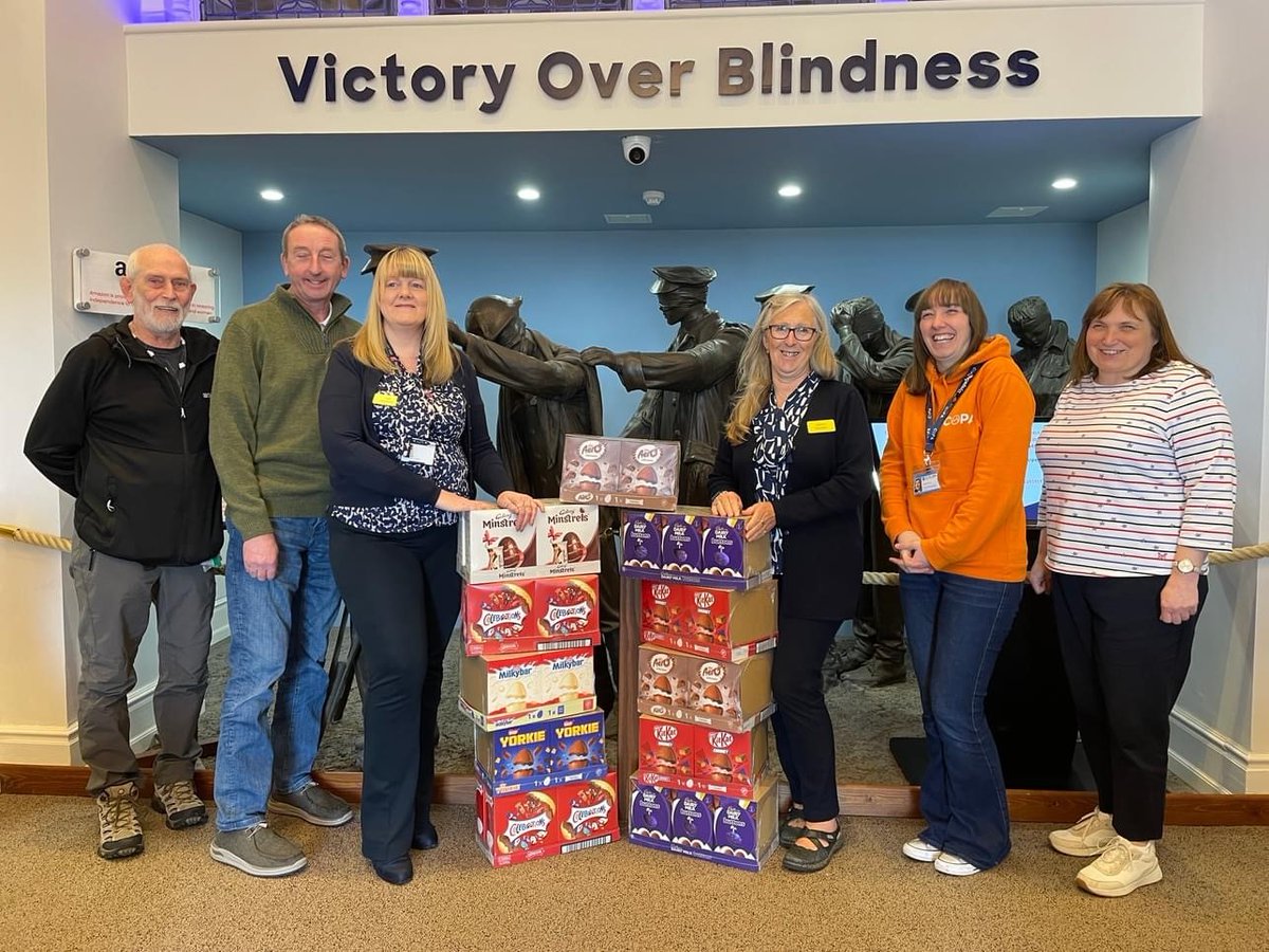 A huge thank you to @copa for their incredible donation of Easter eggs to our Llandudno Centre. We've been out and about delivering the treats to our blind veterans across North Wales. [Image description: Six people with the eggs in front of the Victory Over Blindness statue]