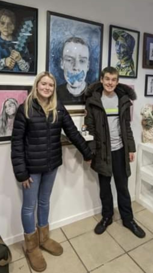 My daughter getting her picture taken for an award she received for her portrait of my son 'The Lost Voice'.Lauren wanted her brother included in the picture &amp; held his hand to make sure he was ok.This is inclusion #DontEraseUs #hope #NeverGiveUp <a href="/sallyephillips/">Sally Phillips</a> <a href="/SENreformNI/">SEN Reform NI</a>