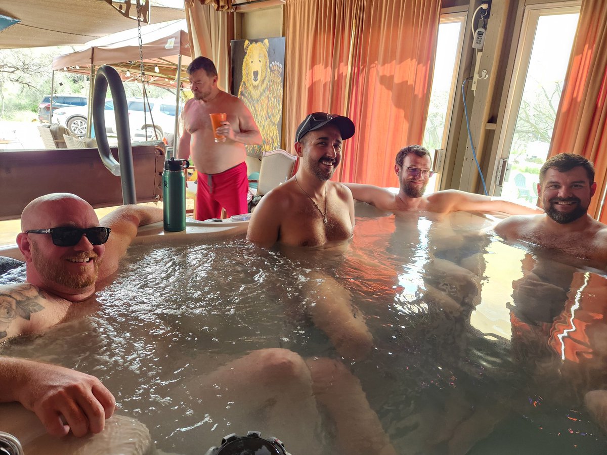 Men are hanging out in the hot tub and a bunch of guys are out hiking on our 40 acres.