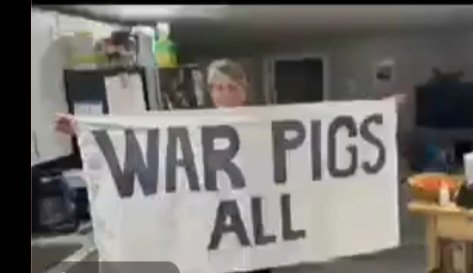 Here is a picture of LaRouche Independent U.S. Senate Candidate Diane Sare showing the banner she held up in front of the three war pigs #BidenObamaClinton before she was hauled out by their hired goons at #RadioCityMusicHall #WarPigsAll