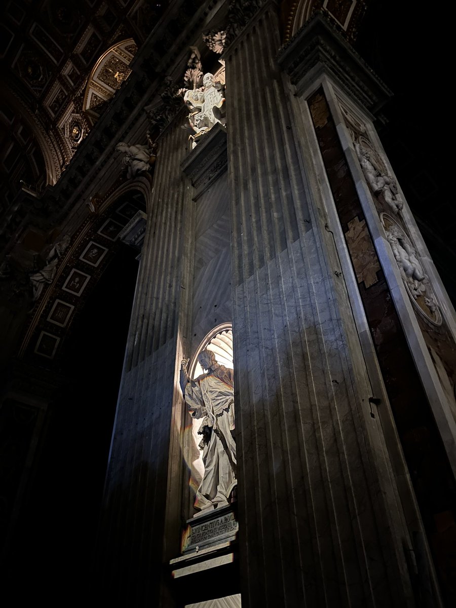 At the beginning of the Easter Vigil at the Vatican, only the light of the saints illuminates the basilica.