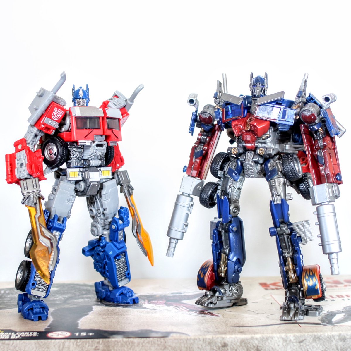 optimus prime blue eyes holding standing weapon multiple boys sword holding weapon  illustration images
