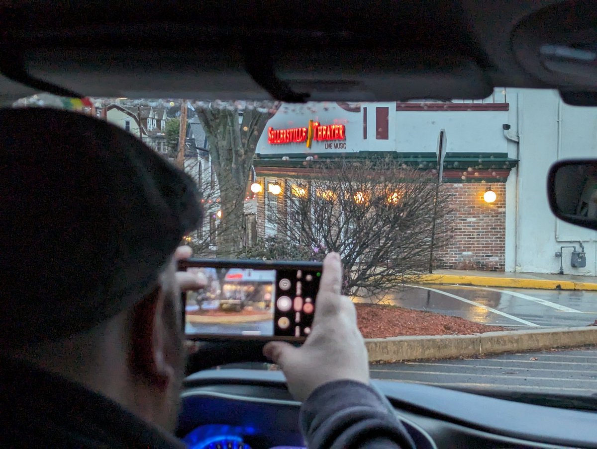 AnonAddict's tweet photo. @EricHutchinson Here's my picture of driver(@chefdon26 ) taking a picture of you (or the venue you are currently at) while we wait in the rain. https://t.co/Ax3ZtusApb