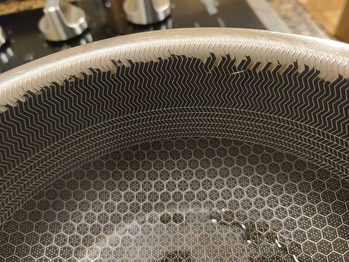 LJefePena's tweet photo. @hexclad these are the deterioration pics of only ONE of our pots. The material is flaking off. We have several other dishes that have held up in the oven, washing, etc. but this guy failed. What are the odds of toxic contamination and can we replace it?? https://t.co/rQ3WsgDu0N