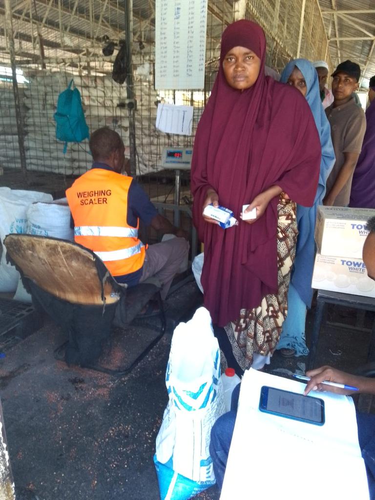 CAREinKenya's tweet photo. Newly registered refugees in Hagadera receiving food aid from @WFP_Kenya, while @CAREinKenya distributes 200gm soap. With CARE's Surge Fund, 3,217 soap pieces will be distributed to 1,227 households. #CIKStrategy #HumanitarianResponse https://t.co/F5bwsXzh1q