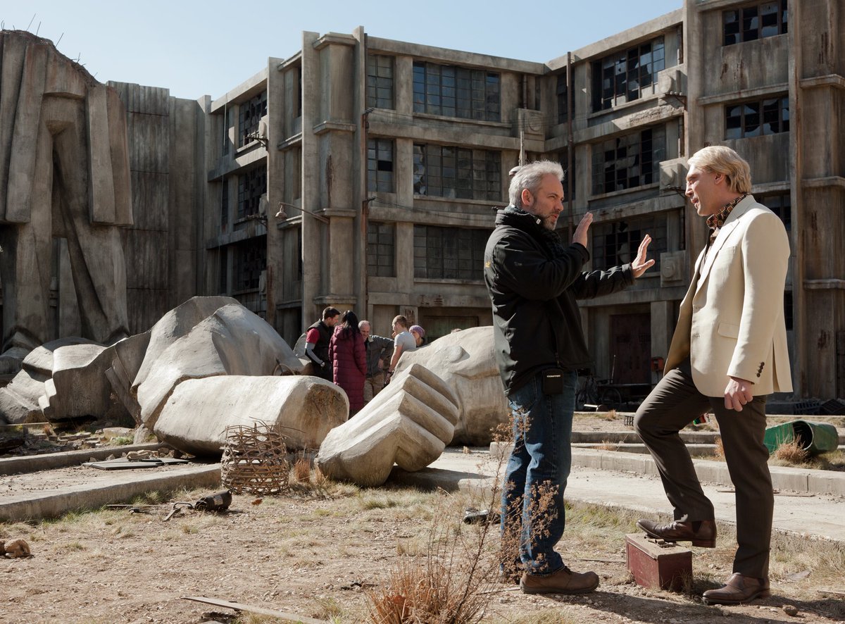007's tweet photo. Pictured on this day in 2012, Daniel Craig (James Bond) and Javier Bardem (Raoul Silva) filmed on the SKYFALL Dead City set at Pinewood Studios. https://t.co/d0z5l34y5C