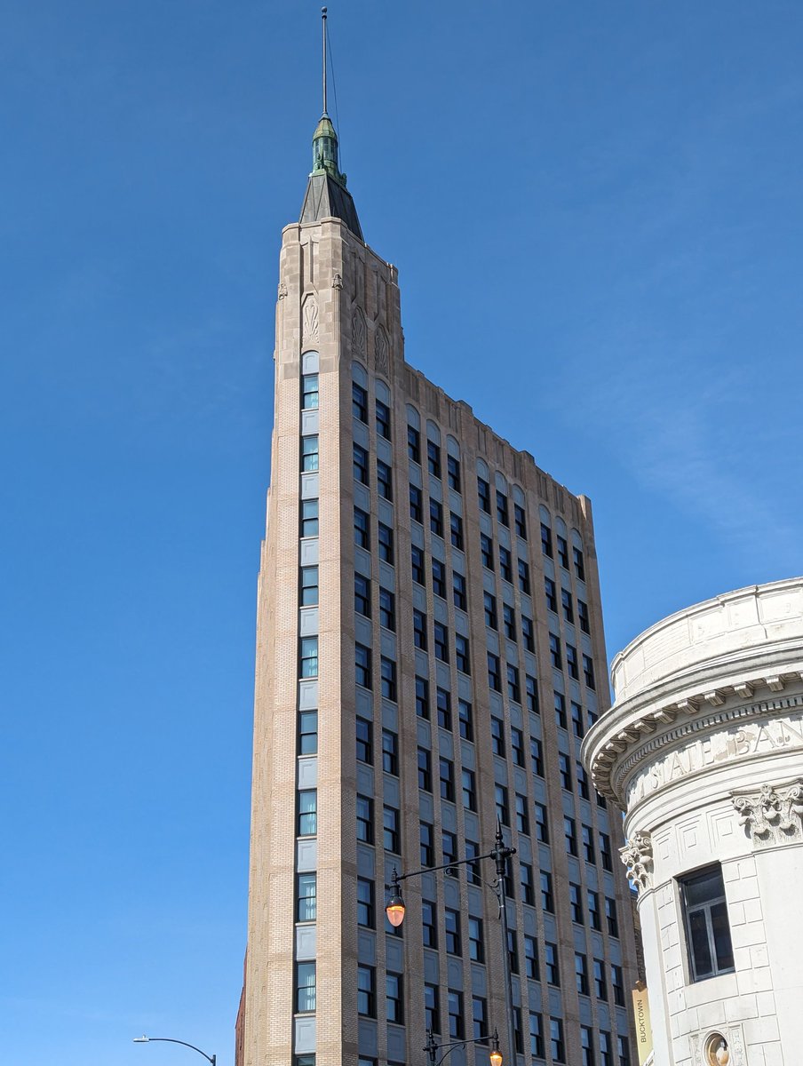 Classical Curve and an Art Deco Spike against a lovely blue sky in Chicago.