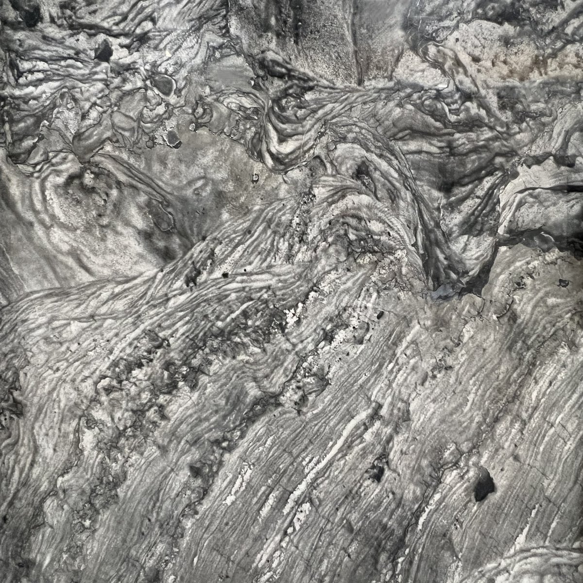 With its rich, deep grey tones featuring sweeping areas of lighter grey, the movement and color of Nickel Quartzite are sure to inspire your next design. Click here for more information: ecs.page.link/pA9rA 

#quartzitedesignideas #ArizonaTile #quartzite #countertopdesigninsp