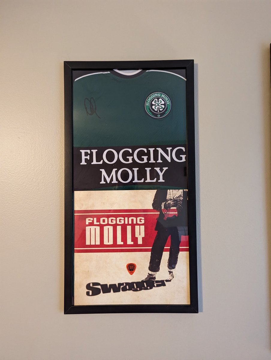 After seeing <a href="/floggingmolly/">Flogging Molly</a> 4 times I got to meet their guitarist, Dennis Casey, after their recent show in Chattanooga. He was super nice, signed my shirt, then gave me his guitar pick. Got them framed and hung up today in my front room where I listen to music.