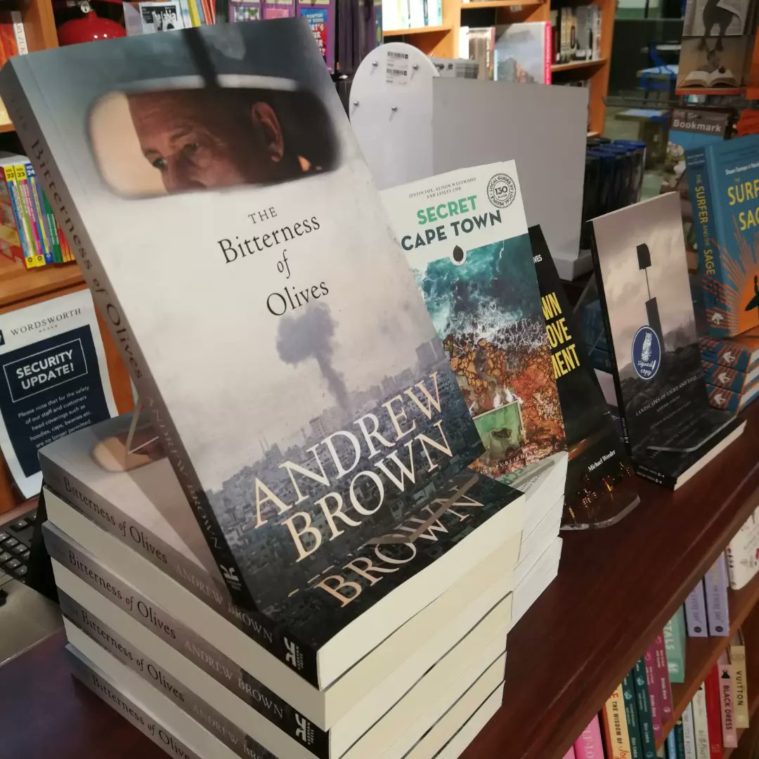 At the Wordsworth Books Gardens launch of THE BITTERNESS OF OLIVES by Andrew Brown. Andrew is in conversation with John Maytham.