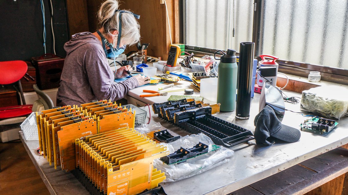Jacinta hard at work soldering circuit boards for a live satellite tracking system. This is to track whales  entangled in fishing gear.