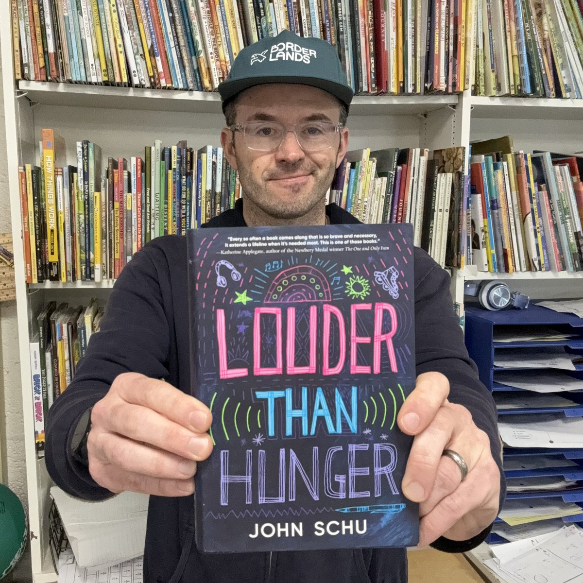 This is me holding my friend John Schu’s beautiful brand new book. You should buy this book because it is brilliant and important. I’d love to see this book on next week’s best seller lists. Schu has helped so many books find so many readers. I hope we will help get his