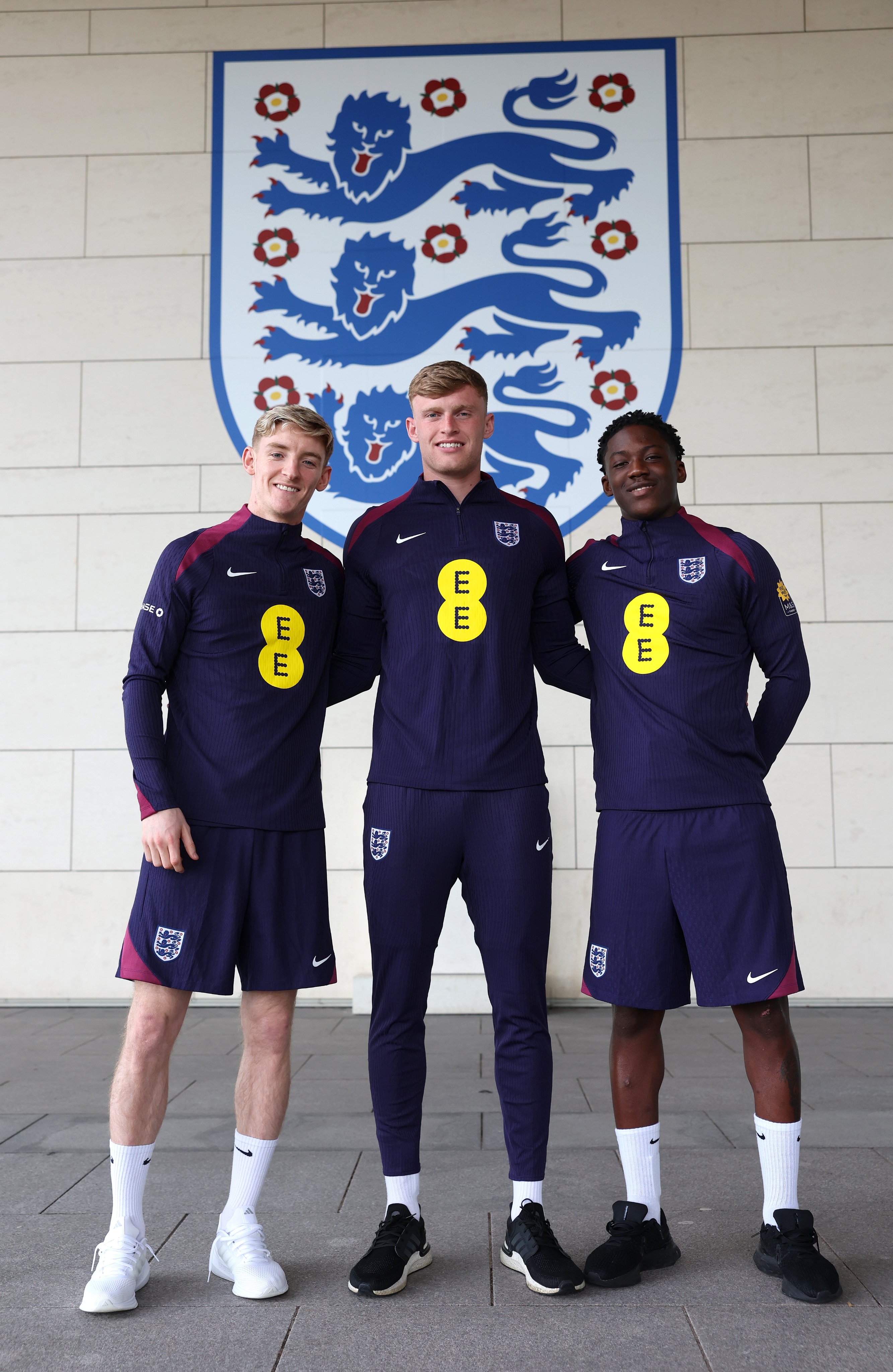 Anthony Gordon, Jarrad Branthwaite and Kobbie Mainoo pose for a group photo at St. George's Park