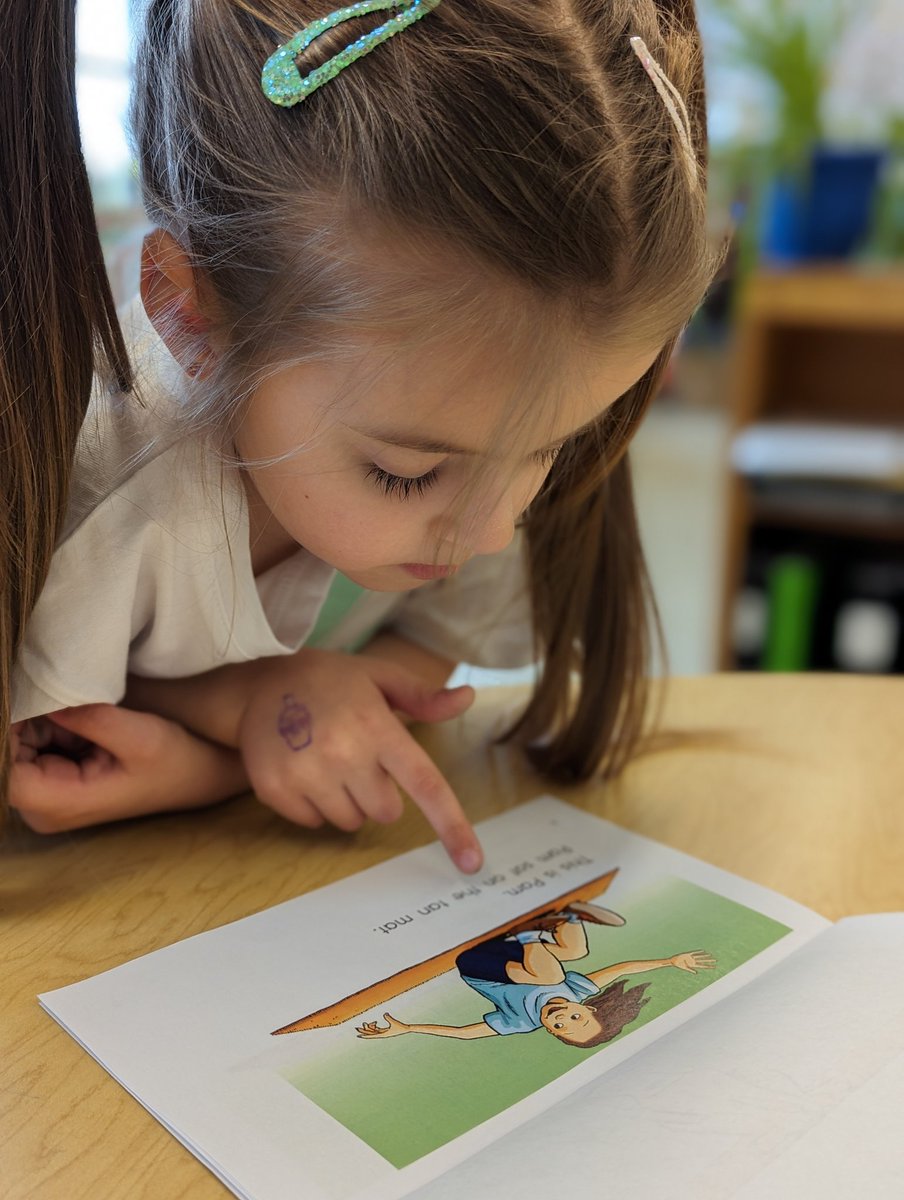 Look at the concentration on this sweet one's face. She's working so hard on her reading. #learningtoread #progress #ELL #tesl @MCEd_NLschools