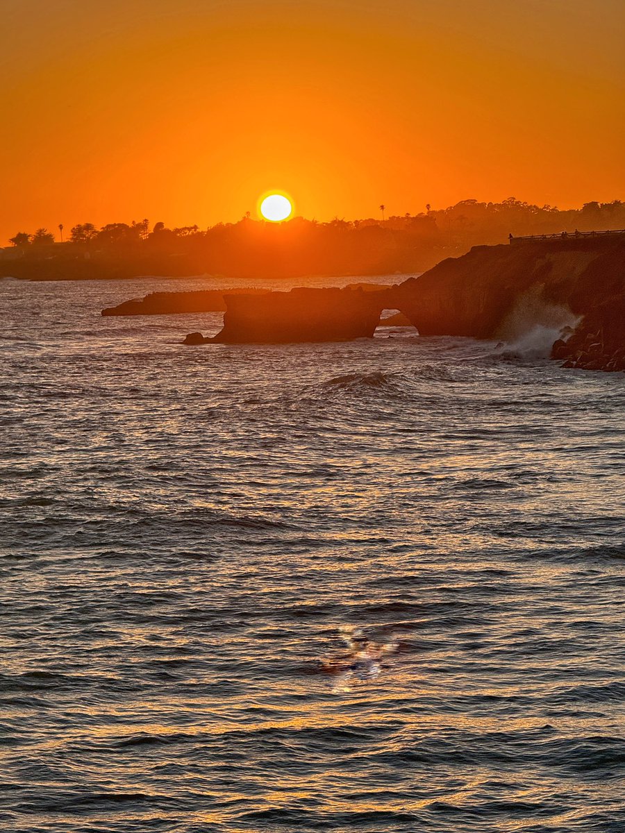NativeSantaCruz's tweet photo. Sunset and the quickly failing rock arch at Its Beach. After recently noticing a big chunk had fallen on the backside, today I saw that this side also lost a large piece and there are now cracks on both sides, as well as across the top of it. https://t.co/IRkV7deZxr