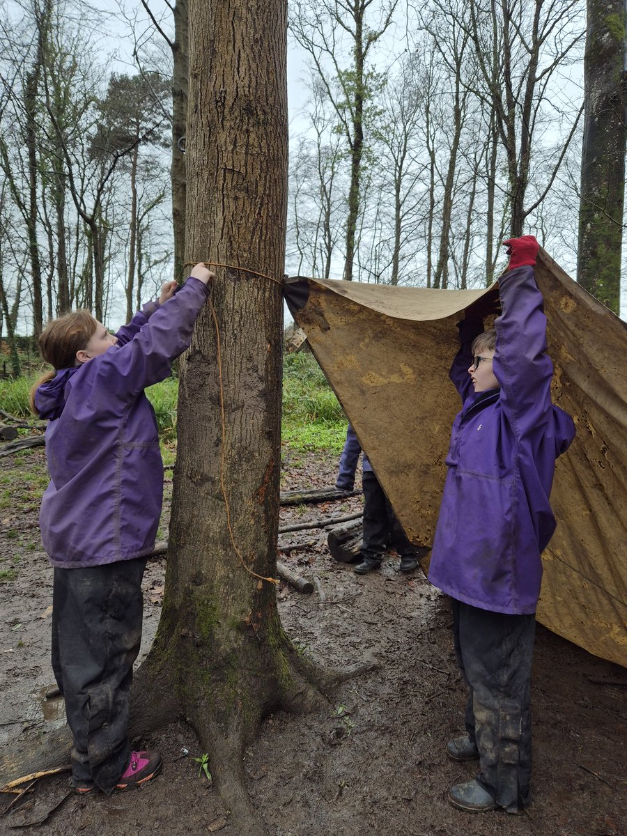 Working as a team to build an emergency shelter.