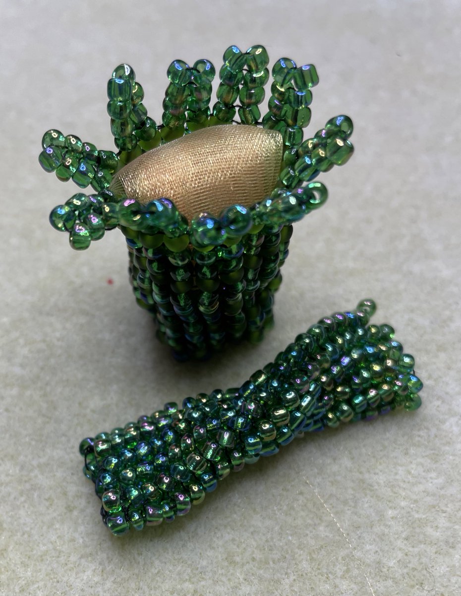 CarolineHack's tweet image. Learning basic #herringbone #beading. The upright example made flat and then joined (with some organza stuffed in it) and tubular - quite flexible - hence the slightly misleading twist