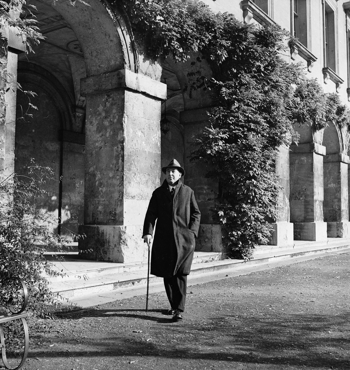 Irish author, scholar, and theologian C.S. Lewis (1898 - 1963) walks past Magdalen College building at Oxford University - Oxford, England, 1946. (📷 Hans Wild/LIFE Picture Collection) #LIFEMagazine #1940s #CSLewis #HansWild #Author #Scholar #Theologian #England