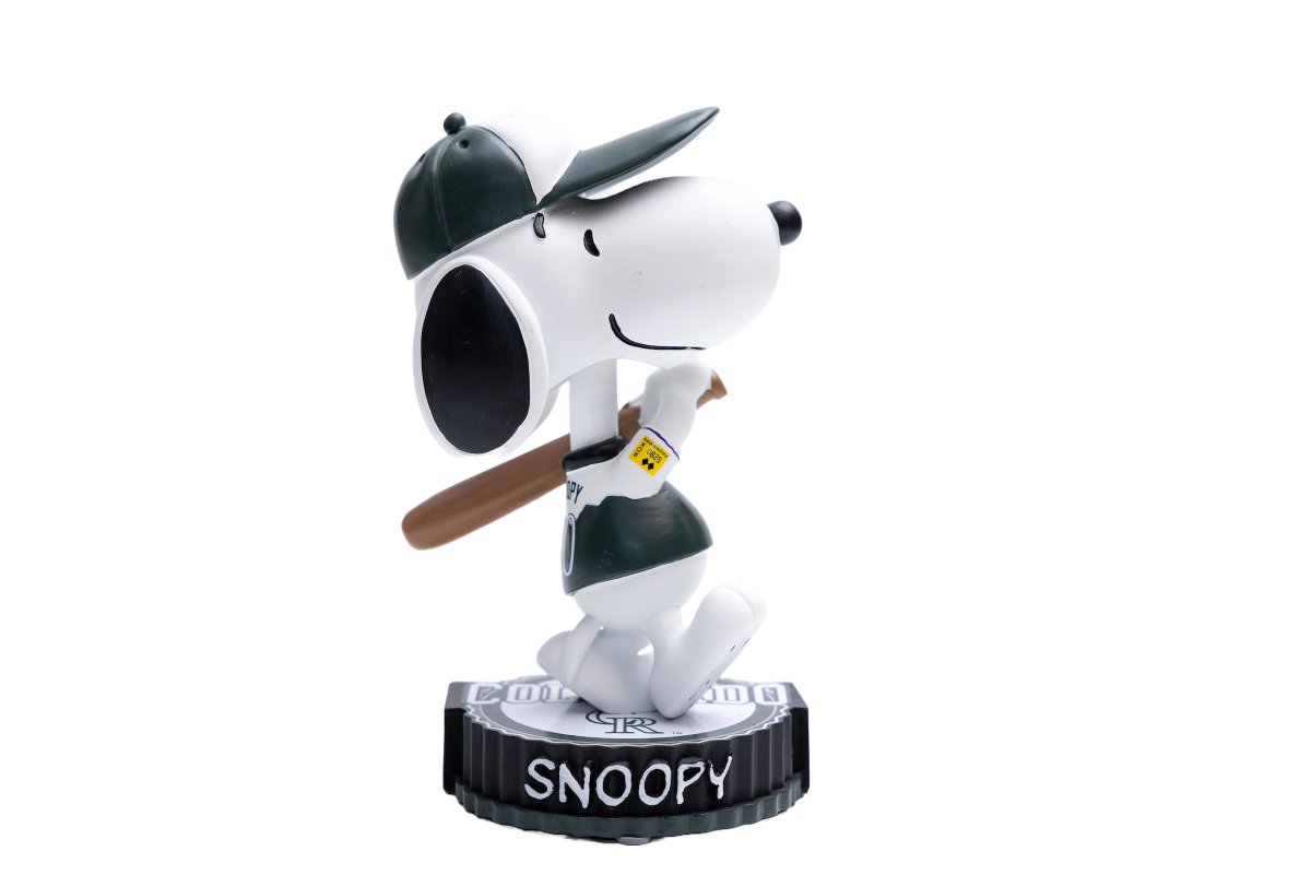 DUGOUT STORE EXCLUSIVE Purchase $150 of merchandise and receive one FREE Limited-Edition Peanuts Bobblehead, of your choice. Charlie Brown or Snoopy in all four jerseys, collect all eight! Limited supply offer. Not available at Diamond Dry or Rally. ⚾️💜🥜's