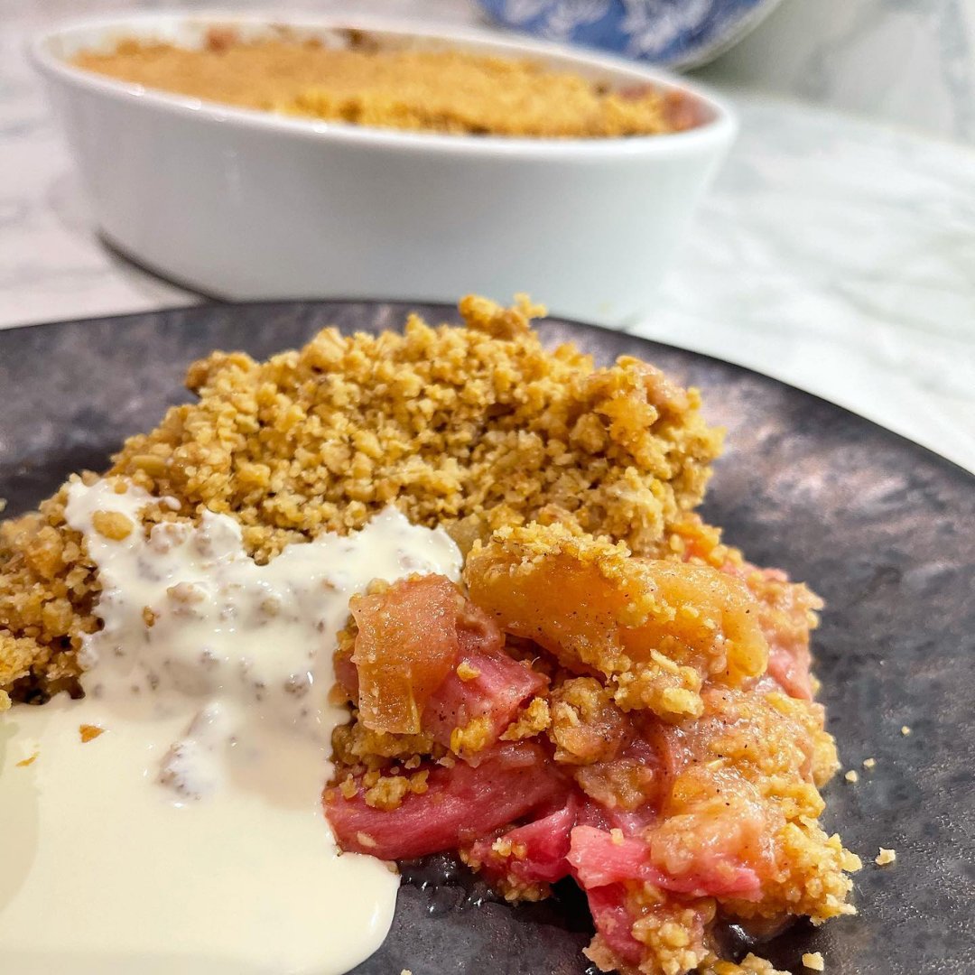 Is there any dessert more comforting than a crumble? This is my Rhubarb and Apple crumble with Vanilla Custard from a couple of years ago. My take on this English classic! #RhubarbCrumble #AppleCrumble #VanillaCustard #EnglishDesserts #HomemadeTreats #BakingInspiration