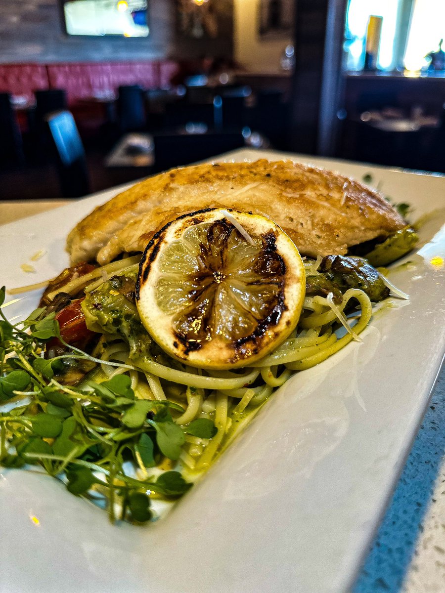 Sautéed filet of Branzino over bed of linguine, tossed with roasted tomato l, mushroom, artichoke and pesto . #fish #italianfood #foodie