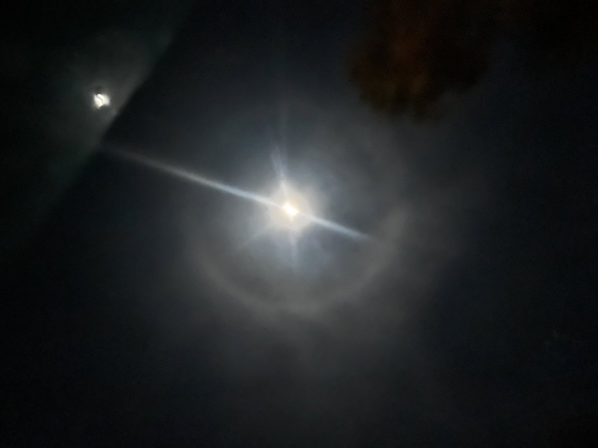 I caught this beautiful circle oflighted clouds around the moon tonight. My photo overemphasizes the moon and nearby star. But what a beautiful cosmo. Look up my friends!