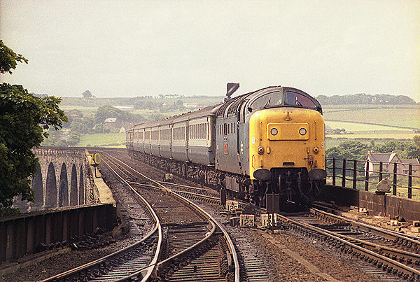 55019 (D9019) 'ROYAL HIGHLAND FUSILIER' hauls the 1S12 05:50 King's Cross - Aberdeen service over the Royal Border Bridge and into Berwick-on-Tweed on the 3rd July 1981
(PaulBettany)