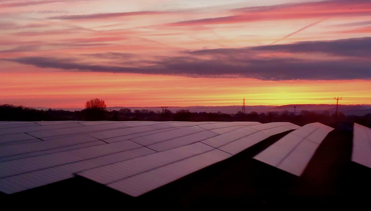 Waiting for the sun 7°C, 15 mins to sunrise Out of the window of the first train - solar farm near Thame, Oxfordshire