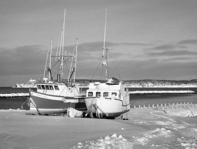 Stan Collins on X: My black and white picture this morning is of two  fishing boats on the shore in Rocky Harbour just waiting to be put back in  the water for