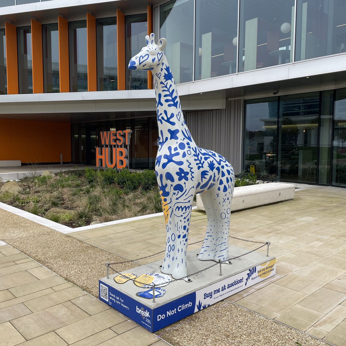 🦒 Meet Hubert of West Hub, First of His Name, Leader of the Tower of Standing Tall! 🌿 The name Hubert means 'bright mind/ heart/ spirit' and pays tribute to the spirit of innovation and bright minds at the Cambridge West Innovation District, with West Hub at the heart of it.