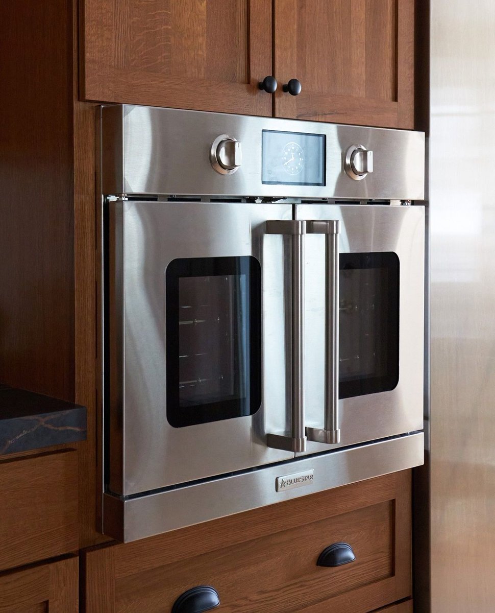 The Dekton Cosentino chosen by these homeowners allows them to place items right out of their @BlueStarCooking French door oven onto the countertop. We matched the @durasupreme oak cabinetry to the veining for a beautifully cohesive design. #customkitchens

Photos #michaelakaskel