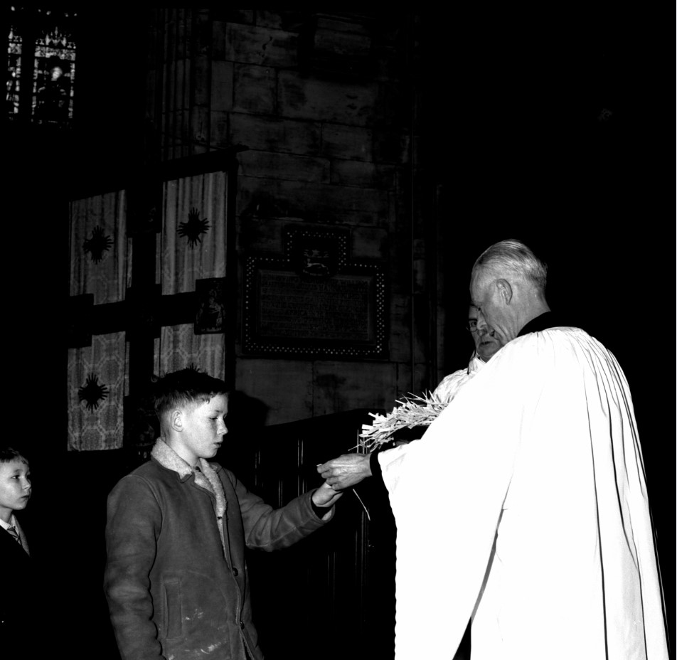 On Palm Sunday, the Church celebrates Jesus’ entry into Jerusalem, where crowds waved palm leaves. Rather than fresh leaves, many churches distribute palm crosses. This 1962 photo shows children queuing up to receive palm crosses at St Peter’s Church, Brighton. [CIO/PHO/NEG/145]