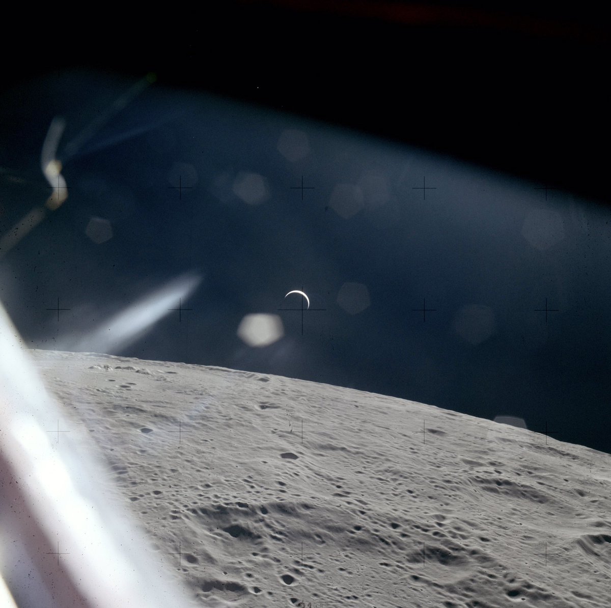 Apollo 15 Crescent Earthrise This beautiful shot of the thin crescent Earth was taken from the Apollo 15 LM window after it had lifted off from the lunar surface and docked back with the CM in lunar orbit.