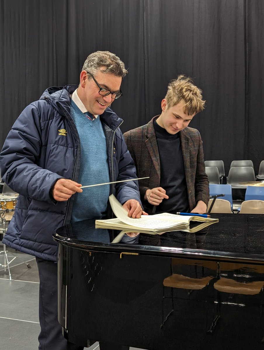 This time last year, Archie was on stage playing the Grieg piano concerto. He returned from Cambridge to help us out on Tuesday, playing a pedal C throughout Chariots of Fire. Progress. 
And now here he is giving Mr S some conducting tips for this evening's concert.