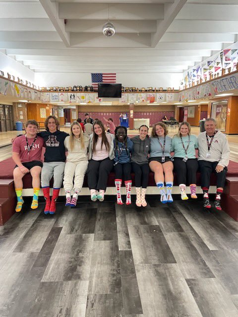 Members of the tennis team (and JB Coyle) showing off their crazy socks in support of World Down Syndrome Day!