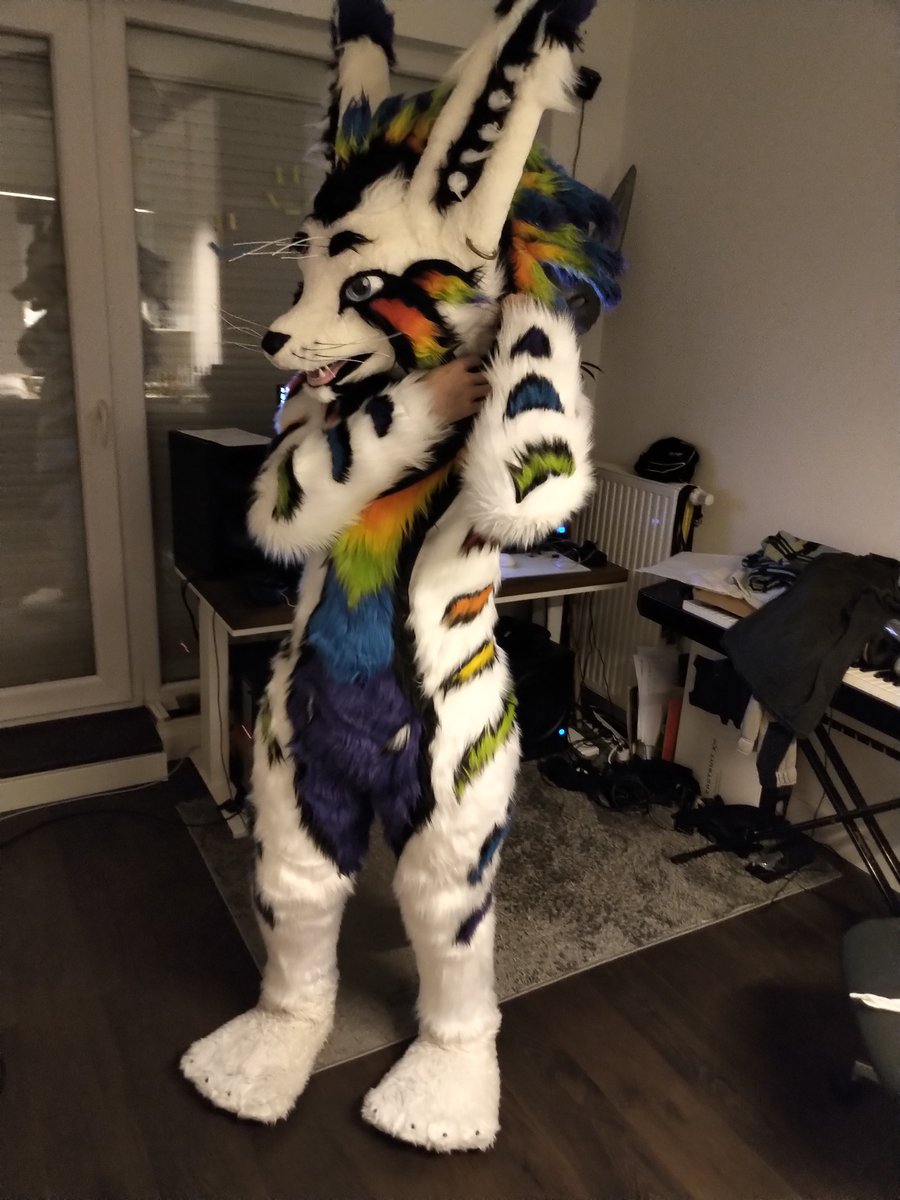Did you guys know I also have a fursuit of my rainbow rex from VR?