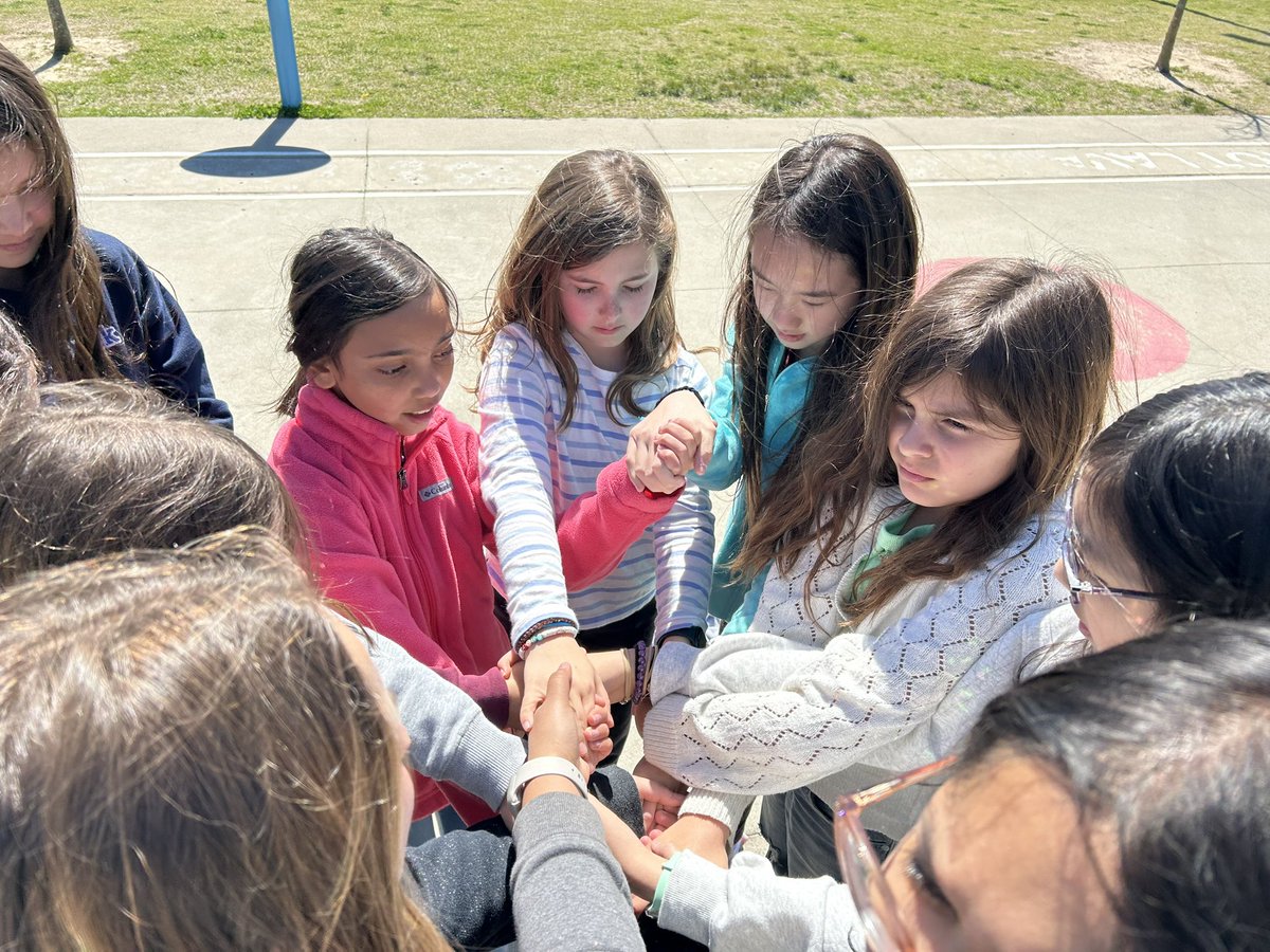 Some of our fifth grade hawks worked together during recess to untangle a human knot. #togetherisbetter @HortonsCreekES