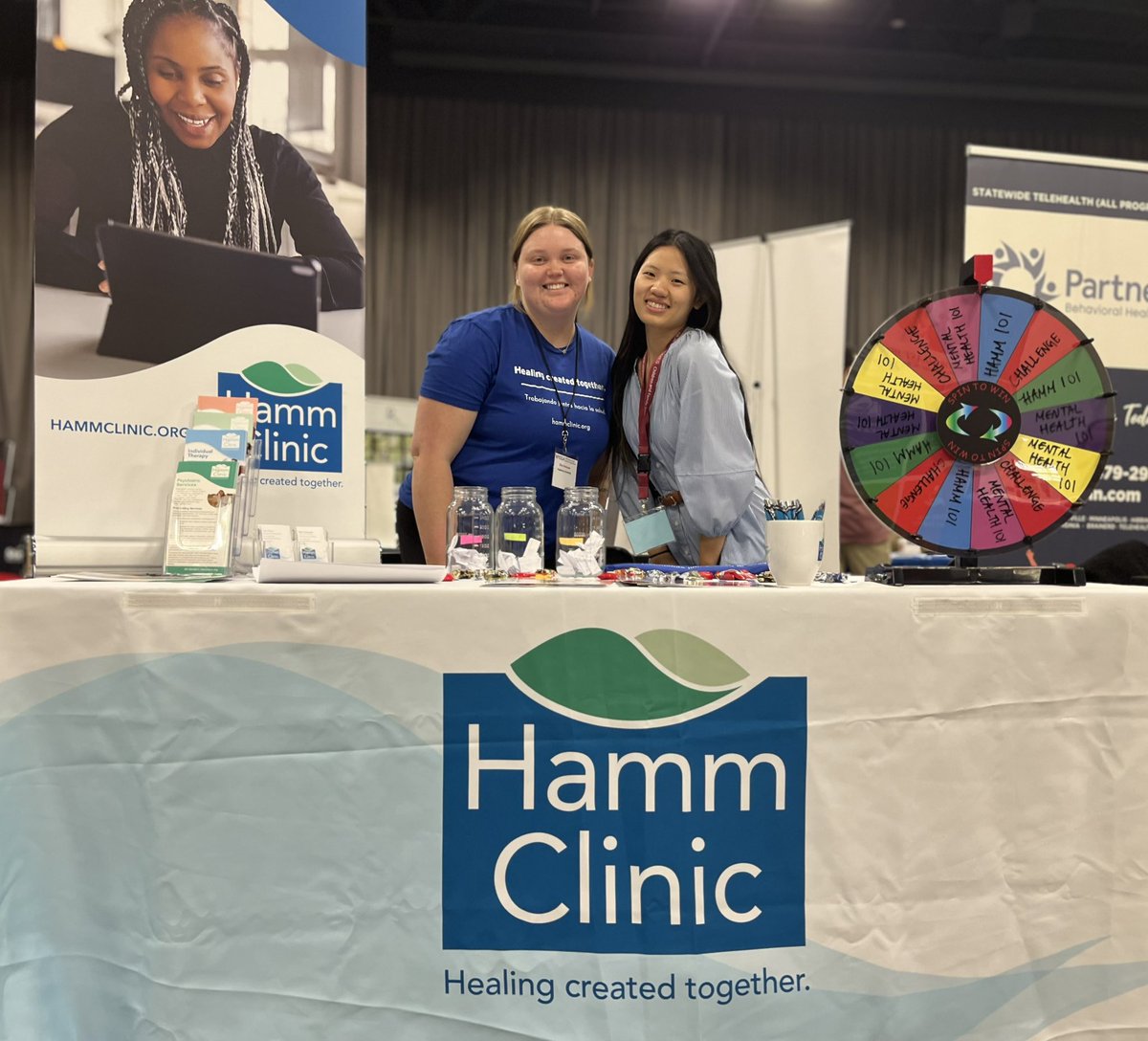 Our Development Associate Tsai and MSW Macro Practice Intern Ellie are welcoming visitors at our MSSA Conference Booth - ask them about #mentalhealth #telementalhealth and spin the trivia wheel
