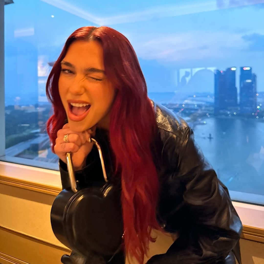 DUALIPA's tweet photo. So fun being back with my @Porsche family for 24hrs in Singapore!!! https://t.co/iW3CEYopAg