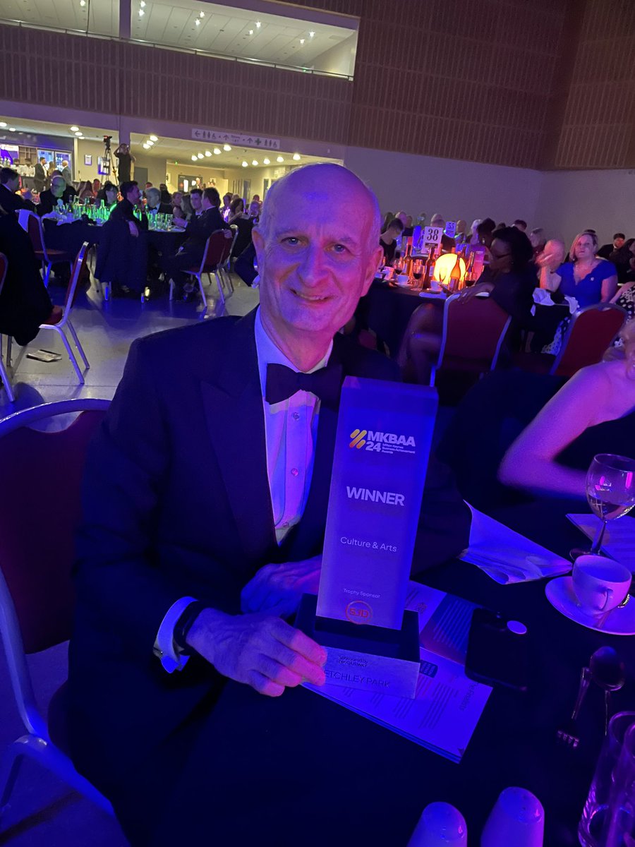 We are prouder than words… @bletchleypark winning the Culture & Arts award at this evening’s @MK_BAA this is @IainStanden holding the trophy!