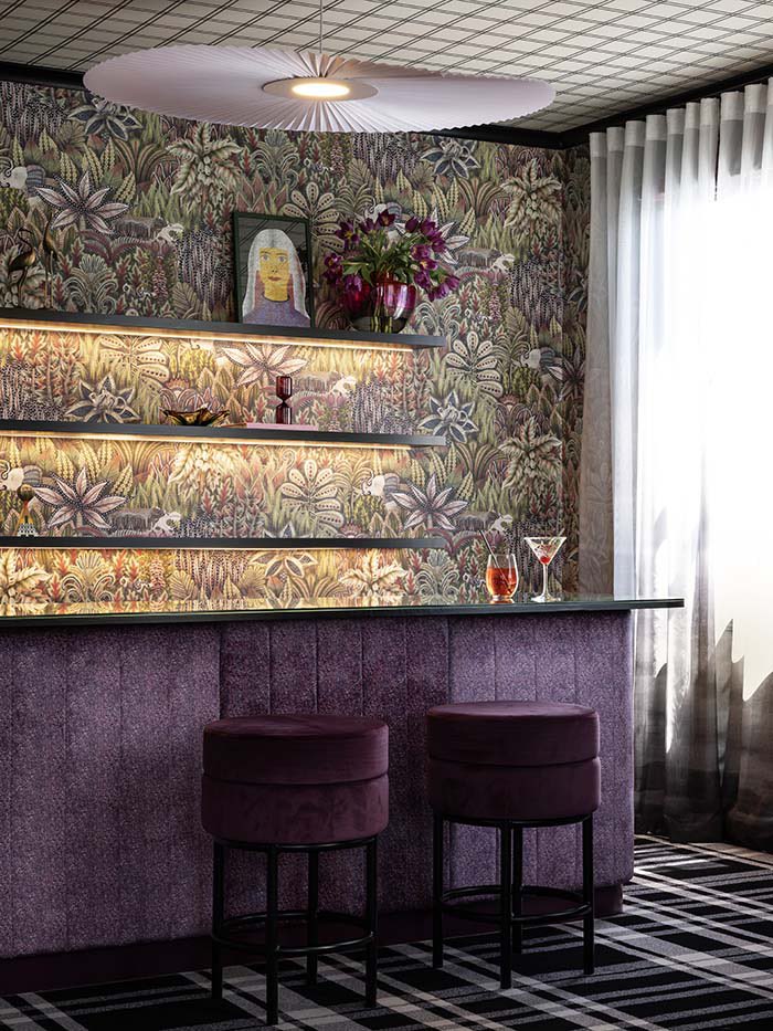 The purple and gold interior of this hotel in New Zealand >>