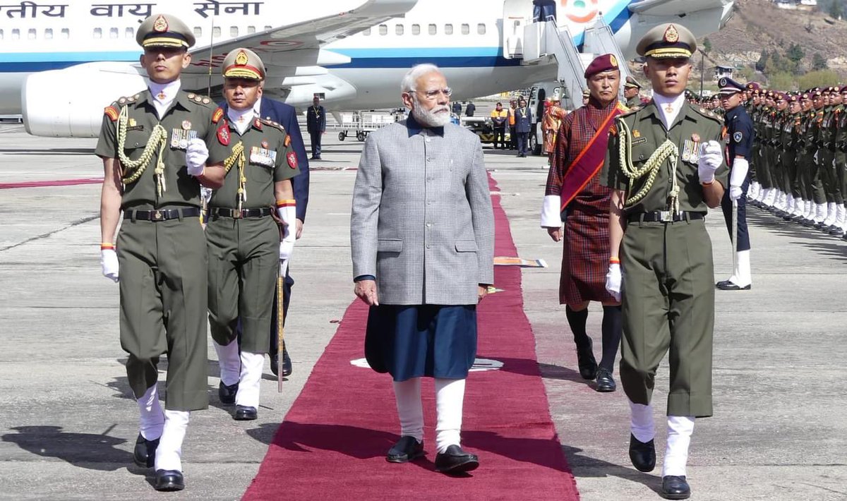 PM Narendra Modi was received with a hug from the Bhutanese Prime Minister Dasho Tshering Tobgay and a guard of honour at Paro International Airport.