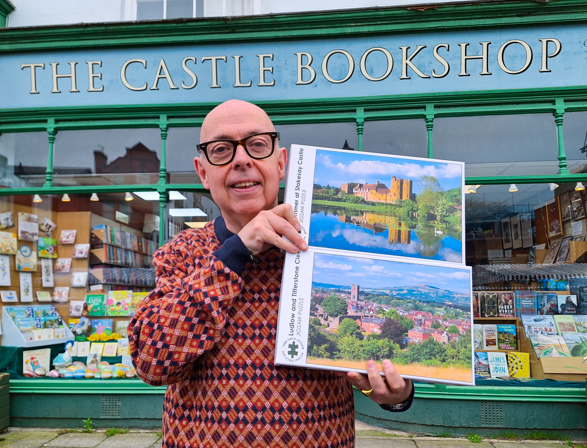 ShropsJigsaws's tweet photo. Stanton Stephens shows off new jigsaws of Ludlow and Stokesay Castle delivered to the Castle Bookshop in Ludlow. If you're not local to Ludlow, you can find the full range of #Shropshire jigsaws on our website: https://t.co/nEqaxt0bwE 🙂 https://t.co/A96fMJRlRH