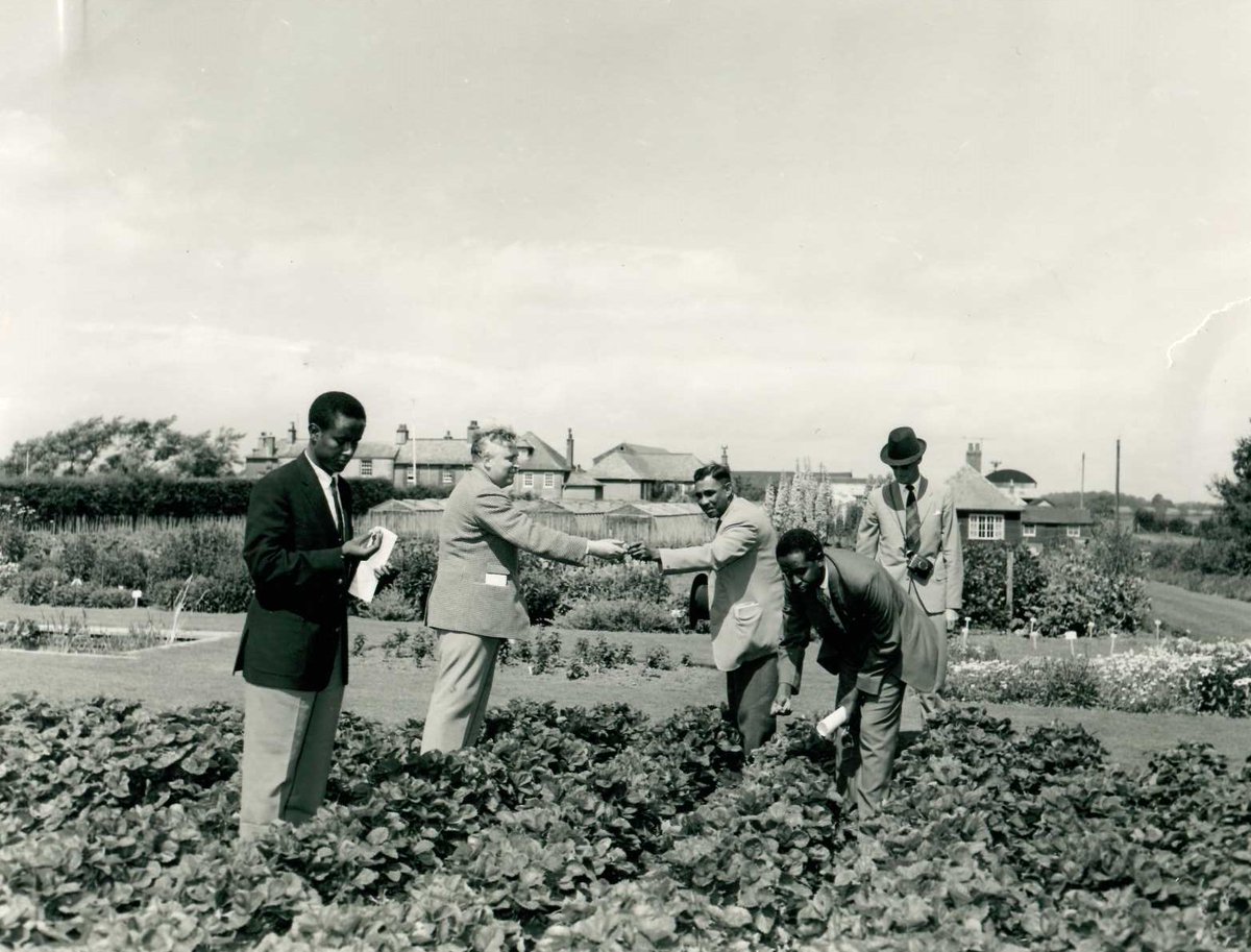 Here shows the Newton Rigg Principal and guests. They were journalists and officers on a trip around the UK, and here they can all be seen exchanging strawberries. #CarlisleArchives #ExploreYourArchives #NewtonRiggCollege @farmernetwork1 @CumbriaYFC @NFYFC @TheMERL