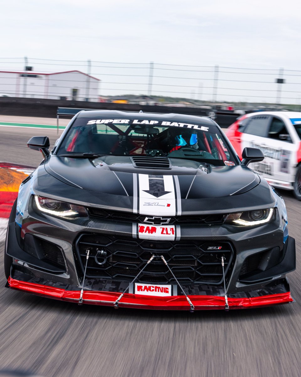 AedanPetty's tweet photo. With a new American flag themed livery at SLB 2024, Jeremy was back again with his extremely loud Camaro ZL1 1LE. Bad for your hearing long term, but badass while you can still hear it! It was a fun time getting these captures of the ZL1 out at Circuit of the Americas! https://t.co/gfmZv4k6p6